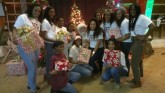HT Cheer and Santa The Huston-Tillotson Cheerleaders take a break while volunteering to get their picture with Santa Clause!