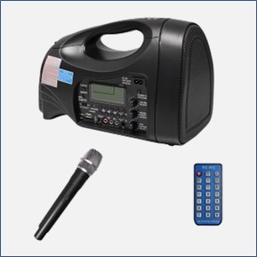 A black portable speaker system with blue remote and black wireless microphone, available to students, faculty, and staff.