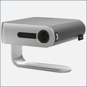 A silver portable projector, lens facing viewer, available to students, faculty, and staff.