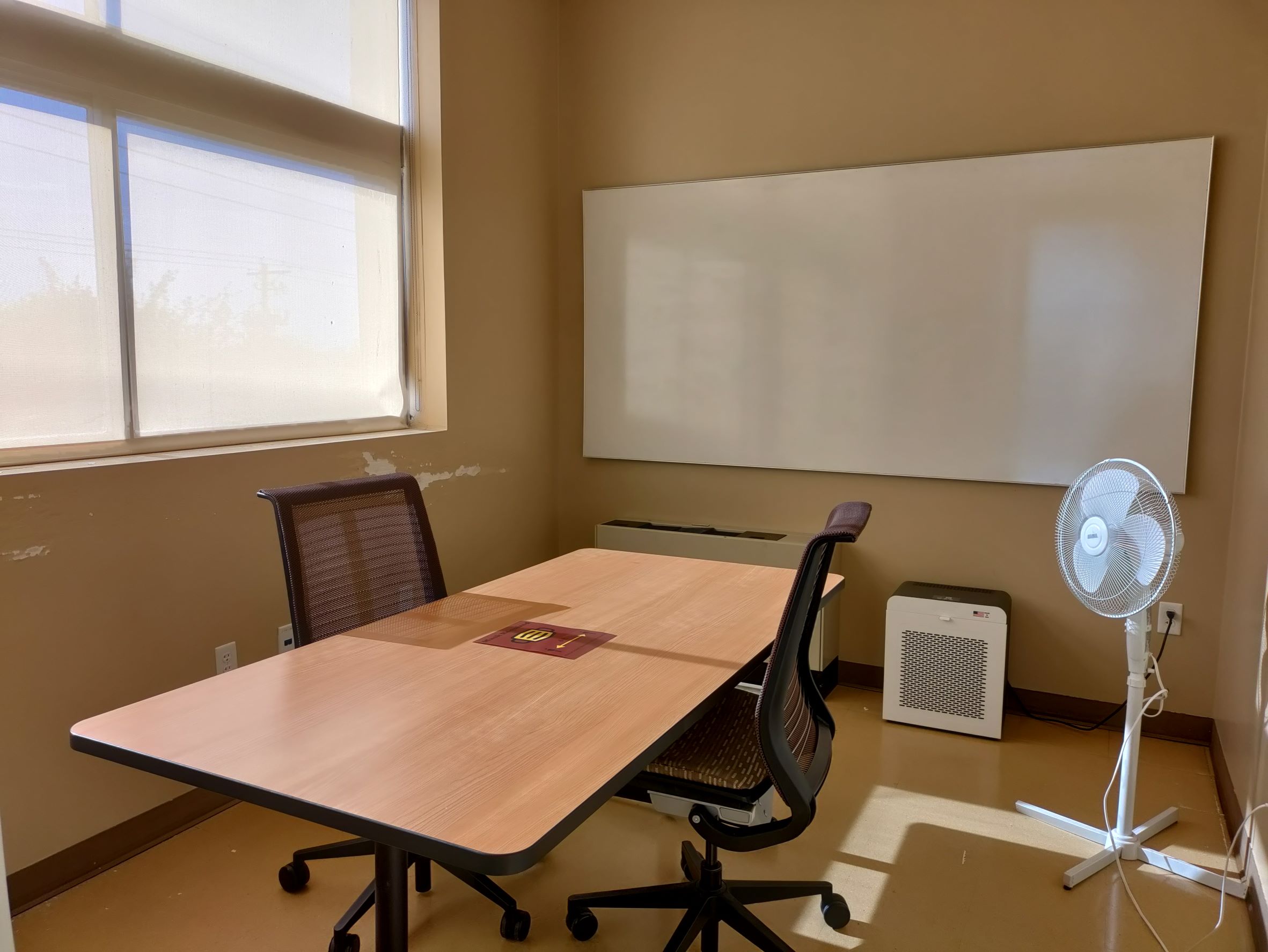 Study Room 204 shows a table with two chairs, a whiteboard, a fan, and an air filter. Blinds cover a window.