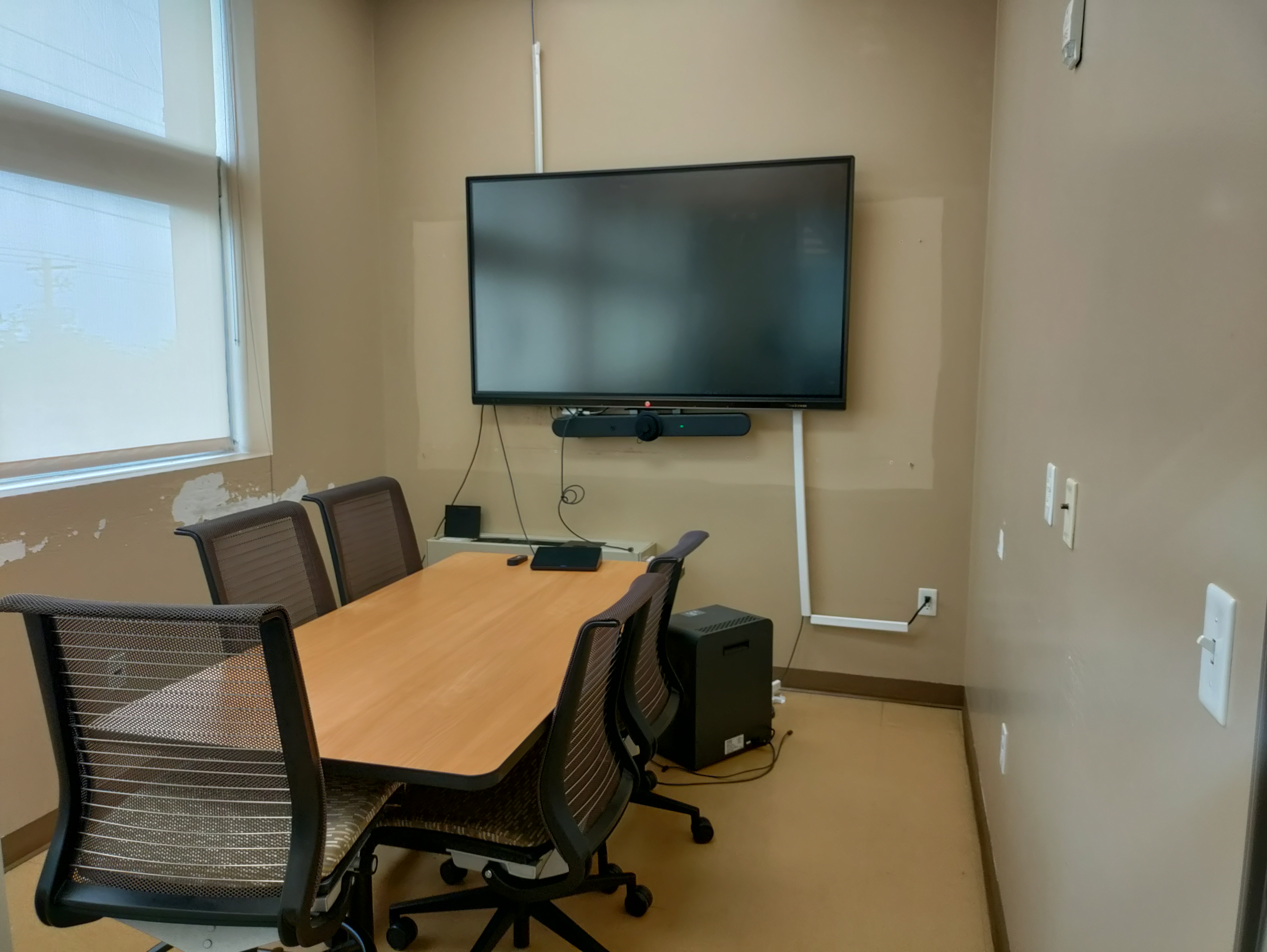 Study Room 204 shows a table with two chairs, a smartboard, and an air filter. Blinds cover a window.