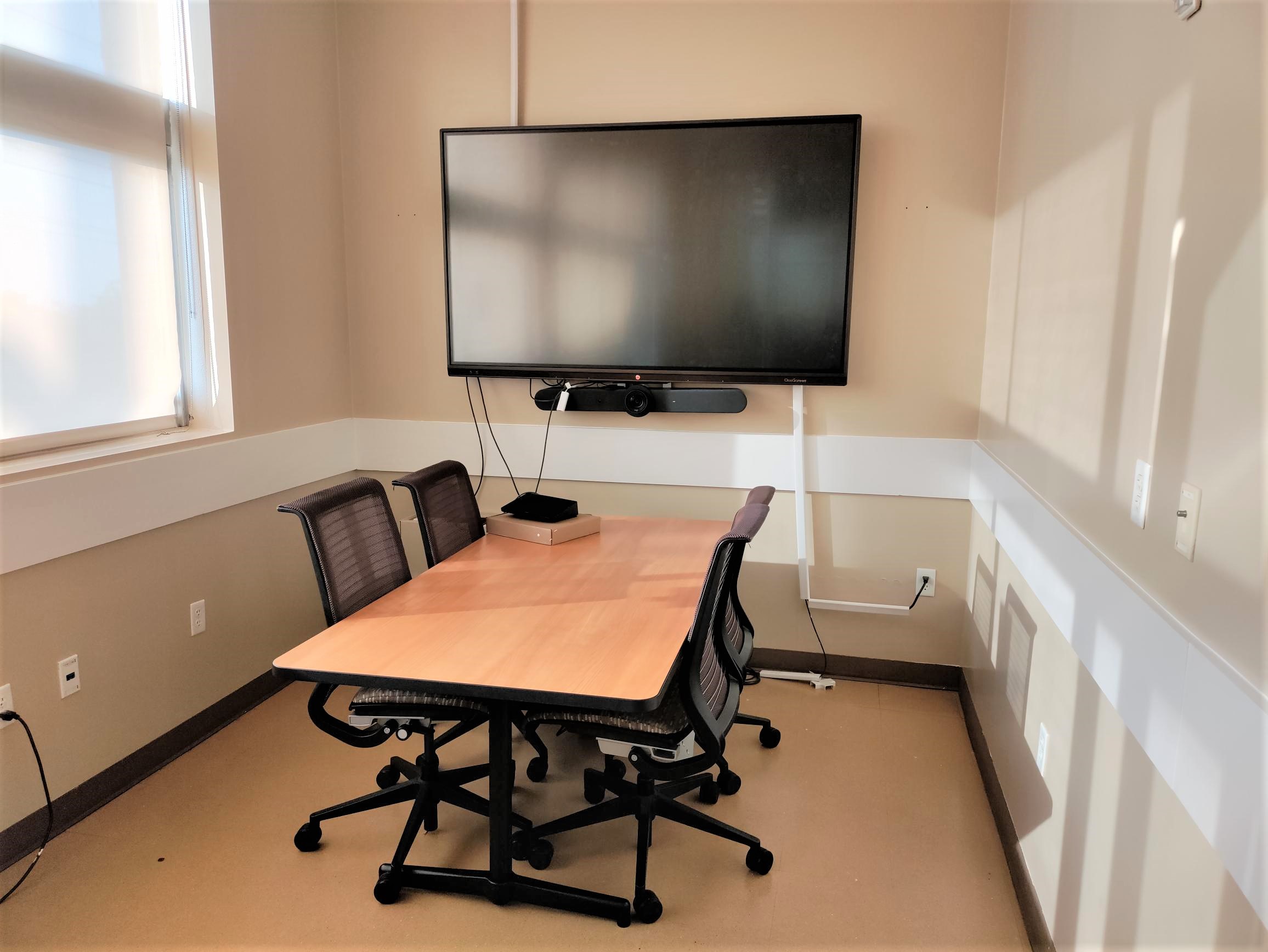 Study Room 204 shows a table with four chairs, a smartboard, and an air filter. Blinds cover a window.